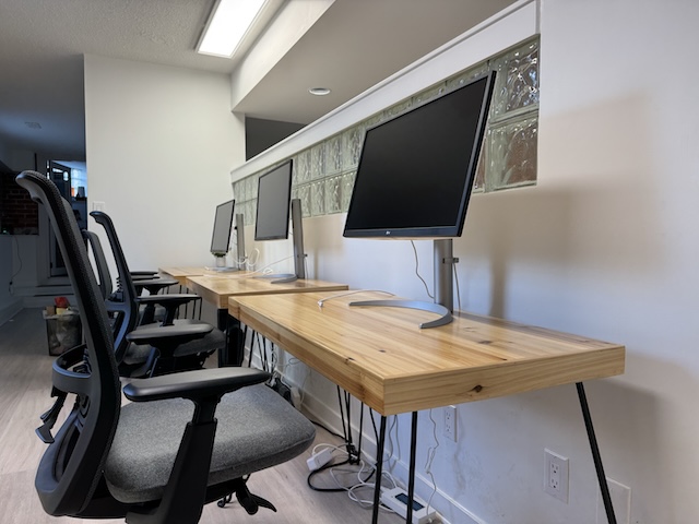 The flexible office desks with monitors and chairs